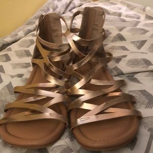 Gold crossing sandals